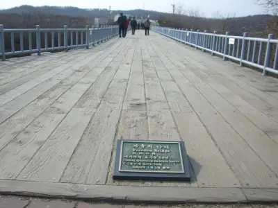 People walking across the Bridge of Freedom at Imjingak Park