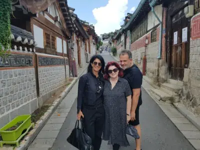 Three people on our Bukchon Hanok Village tour posing stopping for a photo