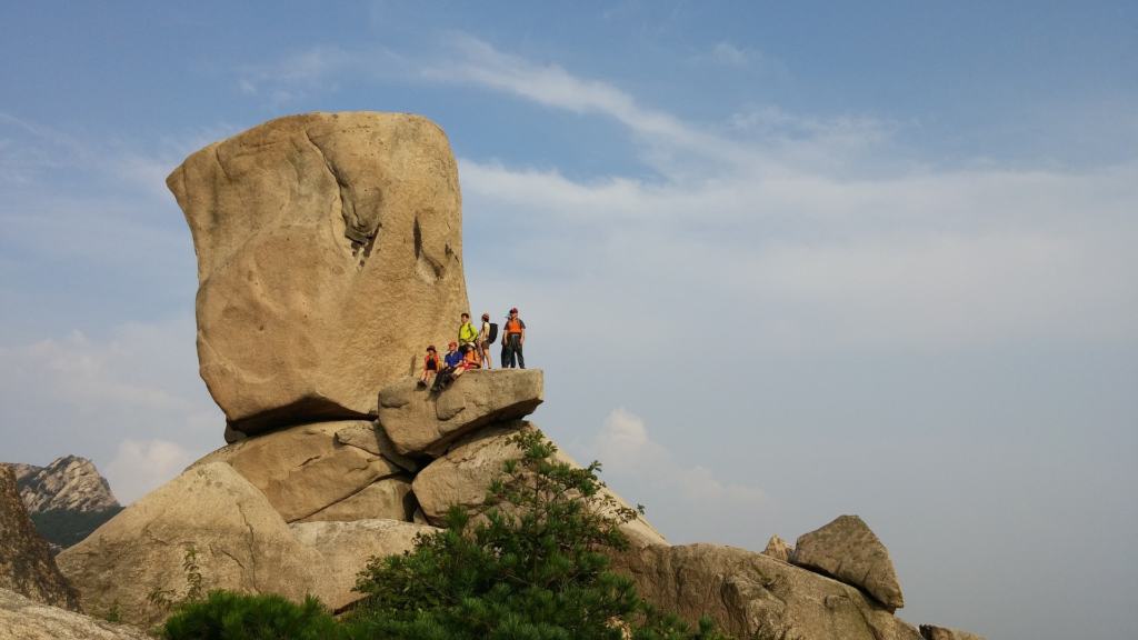 Hiking up to Samobawi rock in Bukhansan National Park with blue sky above