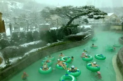 People at Caribbean Bay in winter riding the tubes in heated water