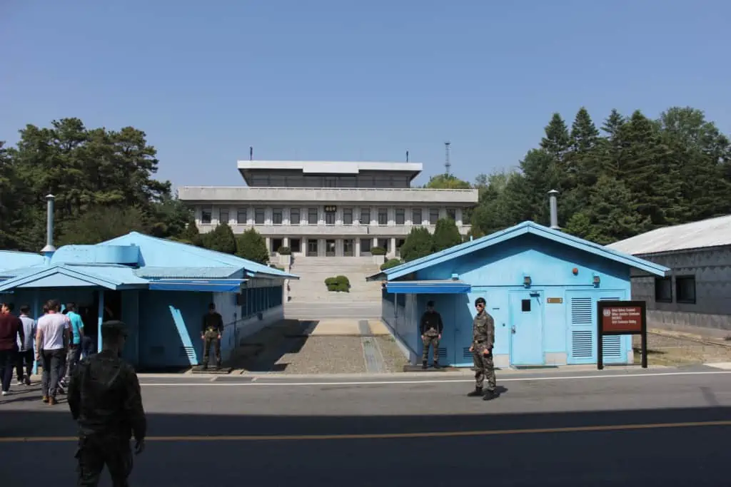 Following our tour group on our DMZ JSA tour. In the background you can see the UNCMAC Conference rooms and North Korea's Panmungak