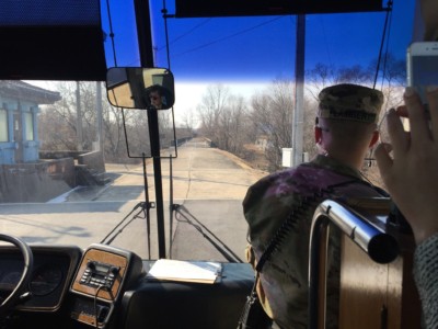 Looking ahead at the bridge of no return through the windscreen of the DMZ JSA tour bus in Korea 