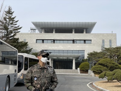 A border guard standing in front of Freedom House inside the Joint Security Area