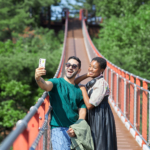 A couple taking a selfie on the Gamaksan Red Suspension Bridge during our Best DMZ Tour from Seoul
