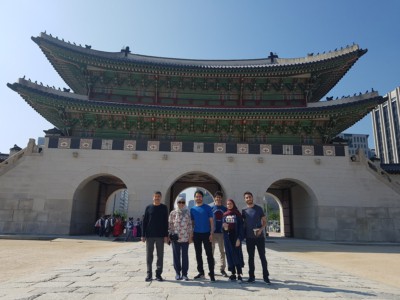 A family on our Gyeongbok Palace tour taking a photo in front of Gwanghwamun gate