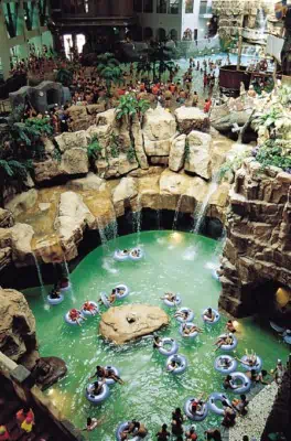 People relaxing on tubes in the large indoor area at Caribbean Bay Korea in winter