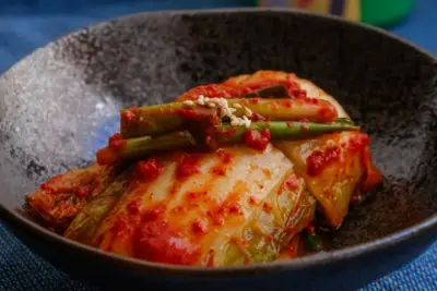 A picture of Kimchi in a side dish bowl 