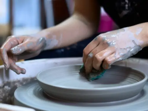 Watching someone demonstrate making pottery at a class