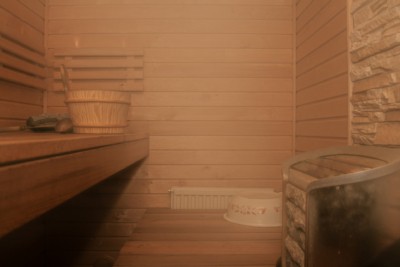 Inside an empty sauna filled with steam