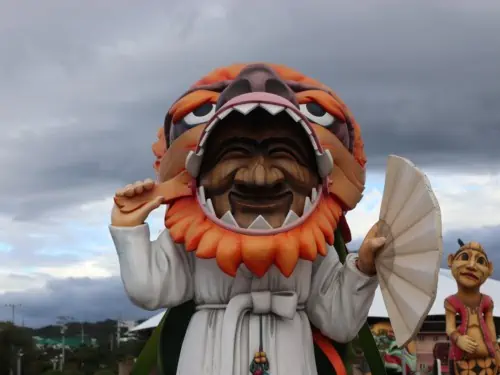 Statue of a dancing figure wearing a Hahoetal mask in Andong