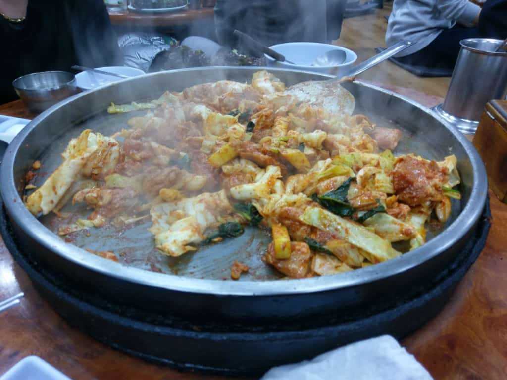 Dak-Galbi is a delicious stir fried spicy chicken usually to be shared by a group of people Dak-Galbi being cooked on the table