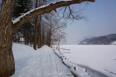 Frozen river view with beautiful snow covered mountains in the background at Namiseom