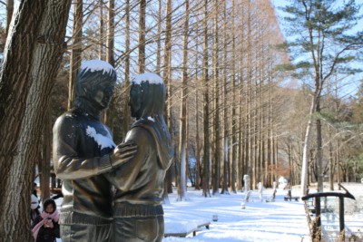 The Winter Sonata statue in Gongsaengwon Garden on Nami Island covered in snow during winter