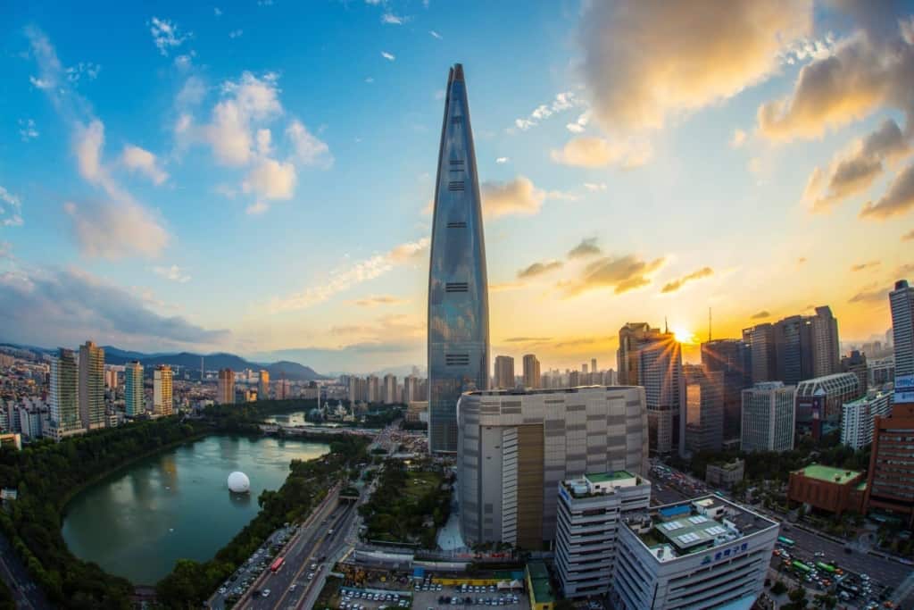 A view of the elegant Lotte Tower building next to Seokchon Lake in Seoul