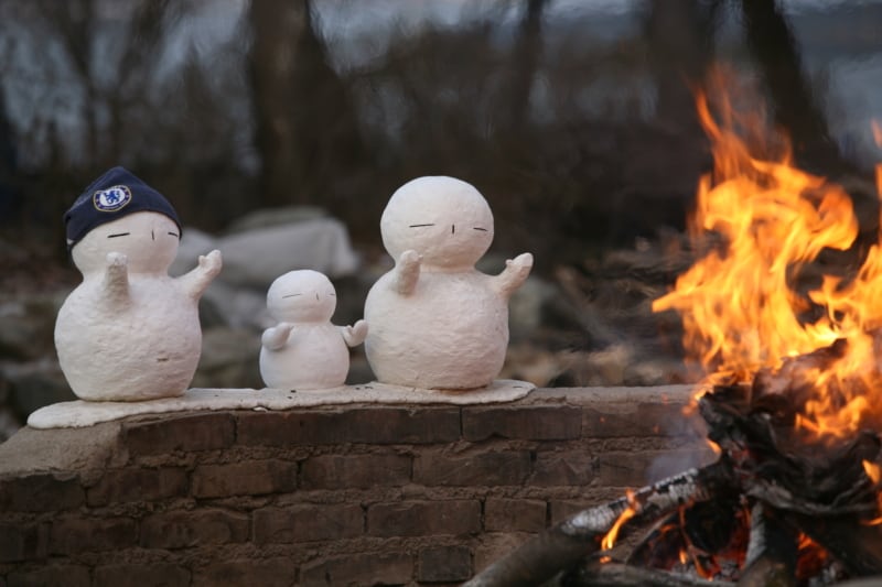 Snowmen enjoying the warm fire at Nami Island in Winter