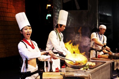 A Nanta Cooking Show performer cooking something live on stage