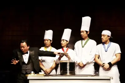 A non-verbal scene during the Nanta Show performance. The manager is tasting the food