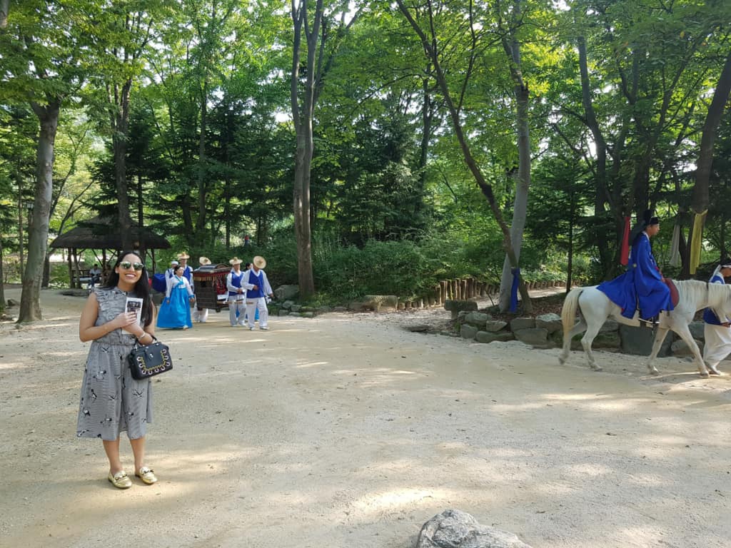 A traditional reenactment of the king and queen being transported at the Korean Folk Village