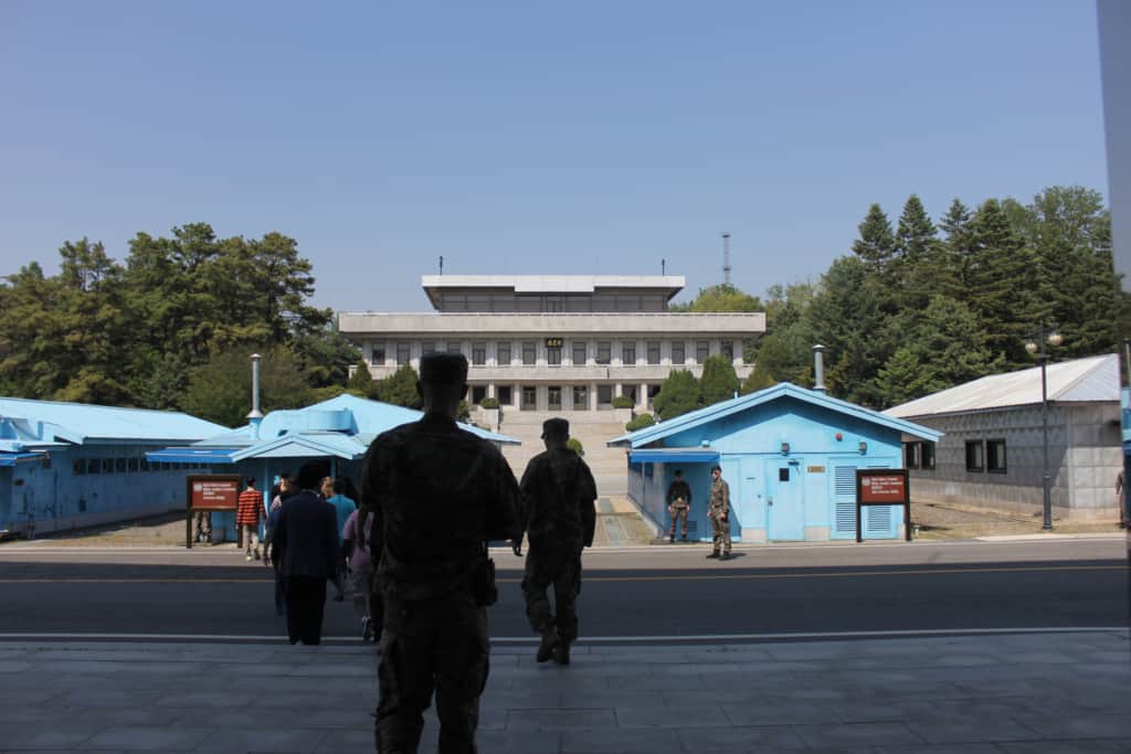 A tour group following soldiers at the Joint Security Area inside the DMZ