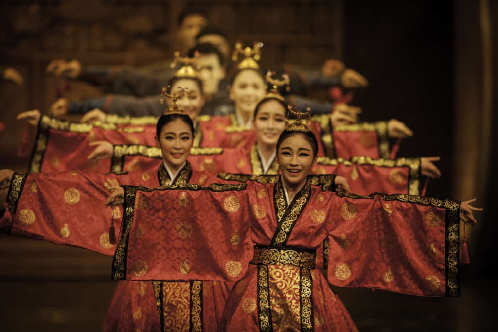 Ladies dressed in red colored hanbok doing a traditional style performance at Jeongdong Theater