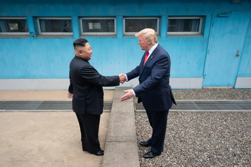 President Donald Trump and Chairman Kim Jong-un shake hands across the border at the DMZ in Korea