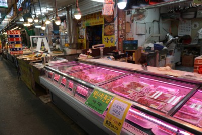 A korean butcher inside a traditional korean market