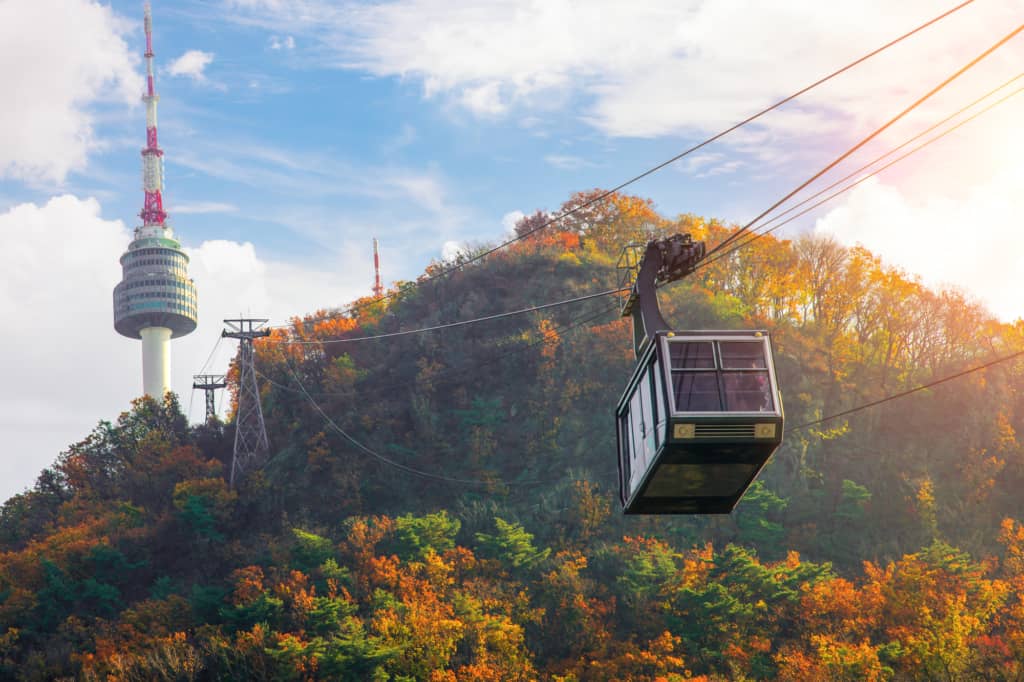 Namsan Cable Car taking passengers up to North Seoul Tower during Autumn in Korea