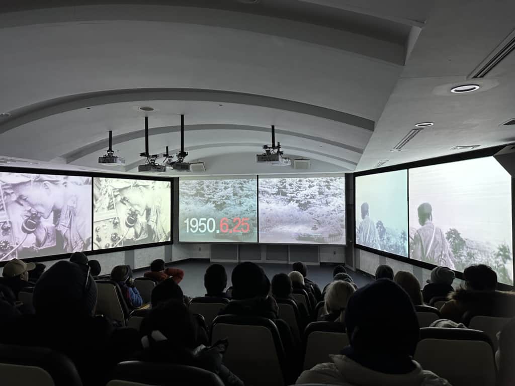 Watching a short explanatory film in the DMZ theater at the 3rd tunnel of aggression