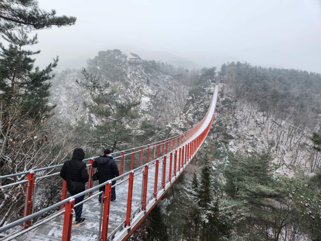 The Gamaksan Suspension Bridge covered in snow during winter