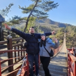 A couple posing for a photo on Gamaksan bridge