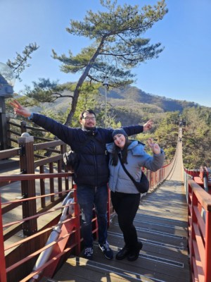 A couple posing for a photo on Gamaksan bridge